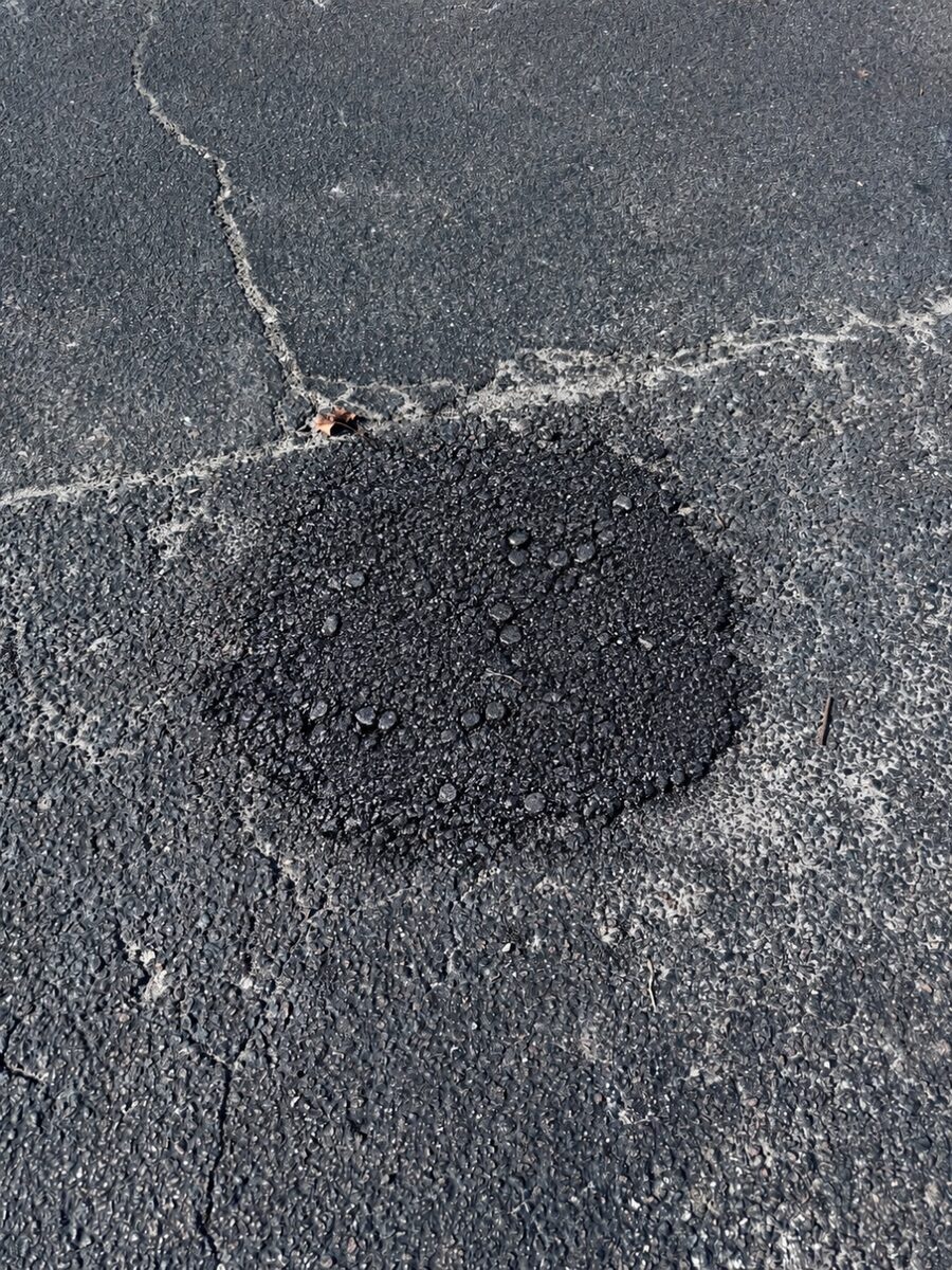 Fresh cold patch fill in the same location, cleanly finished